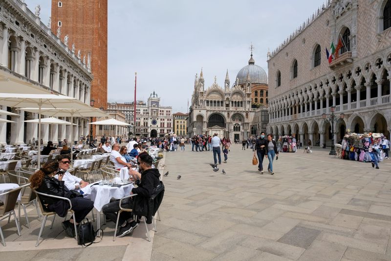 FILE PHOTO: People sit at outdoor tables at St. Mark’s
