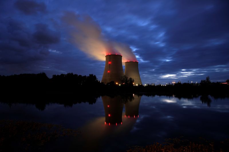 Steam rises from cooling towers of the Electricite de France
