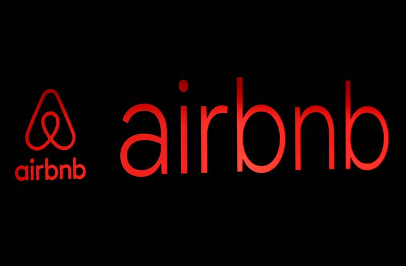 FILE PHOTO: The logos of Airbnb are displayed at an