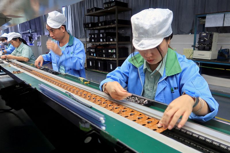 FILE PHOTO: Production line of mobile gaming controllers at a