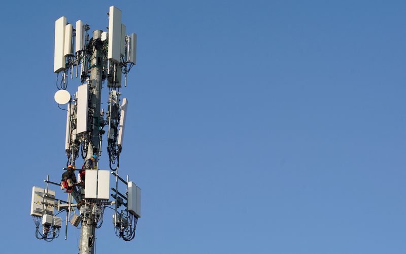A contract crew from Verizon installs 5G equipment on a