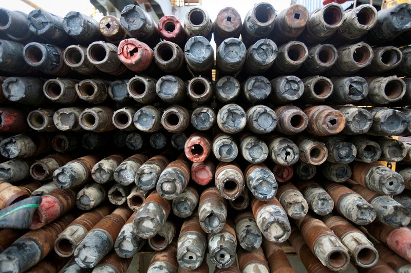 FILE PHOTO: Drill pipes sit aboard an idle oil rig