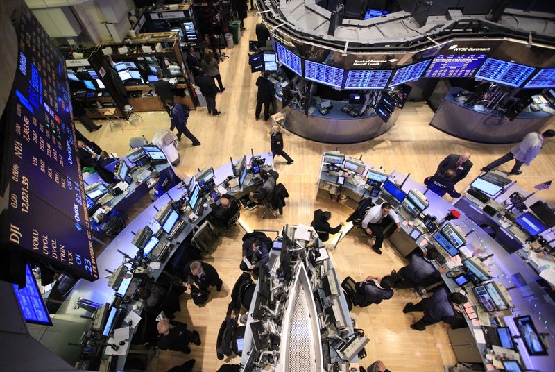 Traders work on the floor of the New York Stock