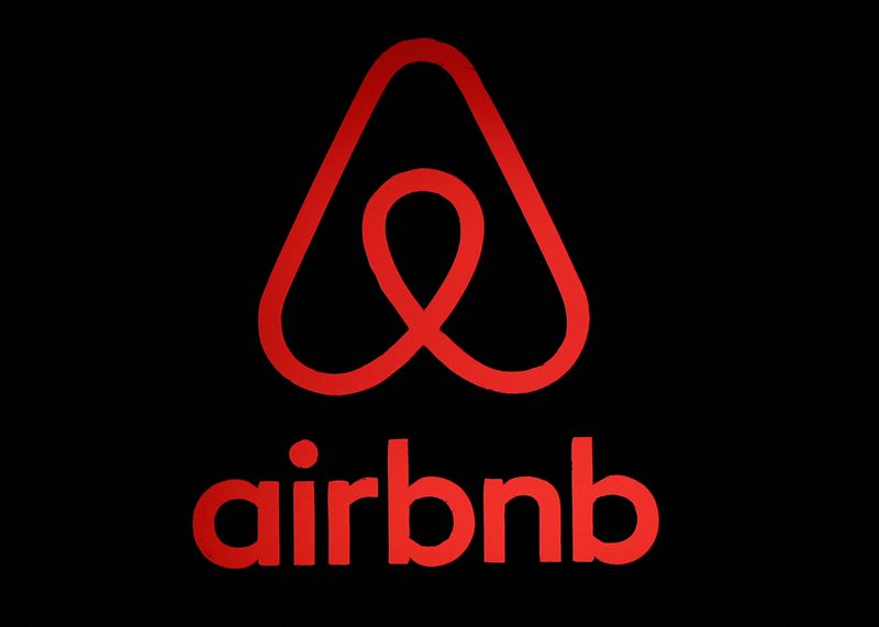 The logo of Airbnb is displayed at an Airbnb event