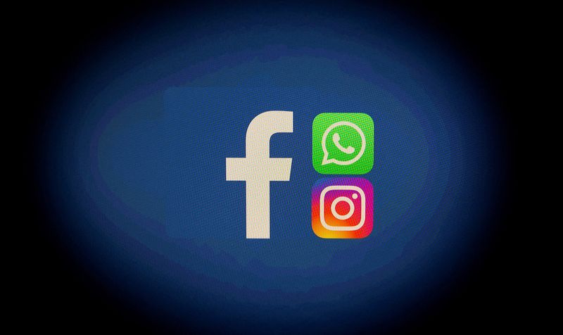 FILE PHOTO: Facebook, WhatsApp and Instagram logos are displayed in