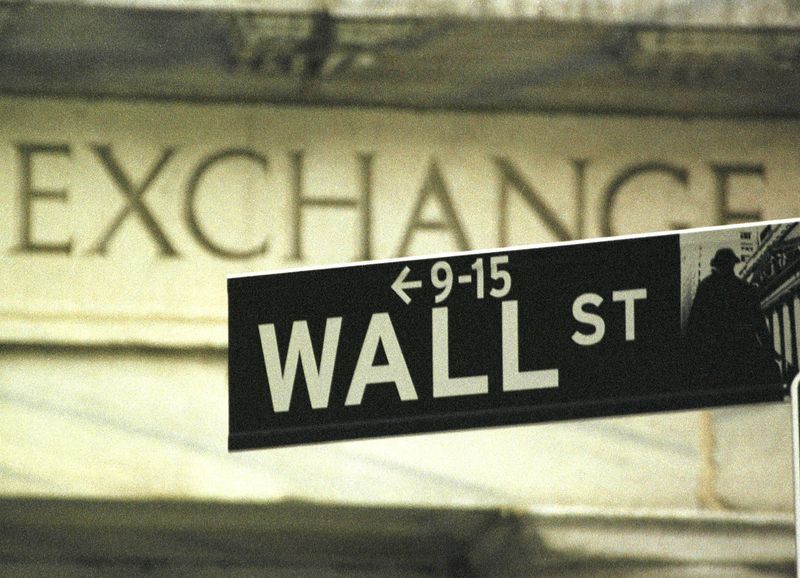 FILE PHOTO: A WALL STREET ROAD SIGN HANGS IN FRONT