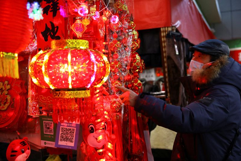 A customer looks at decorations for Chinese Lunar New Year