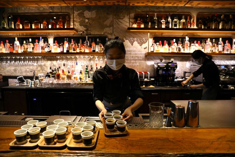 A barista serves coffee at a Starbucks flagship store in