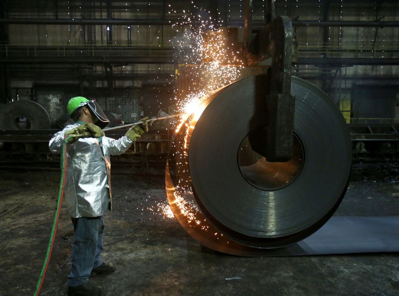 FILE PHOTO: A worker cuts a piece from a steel