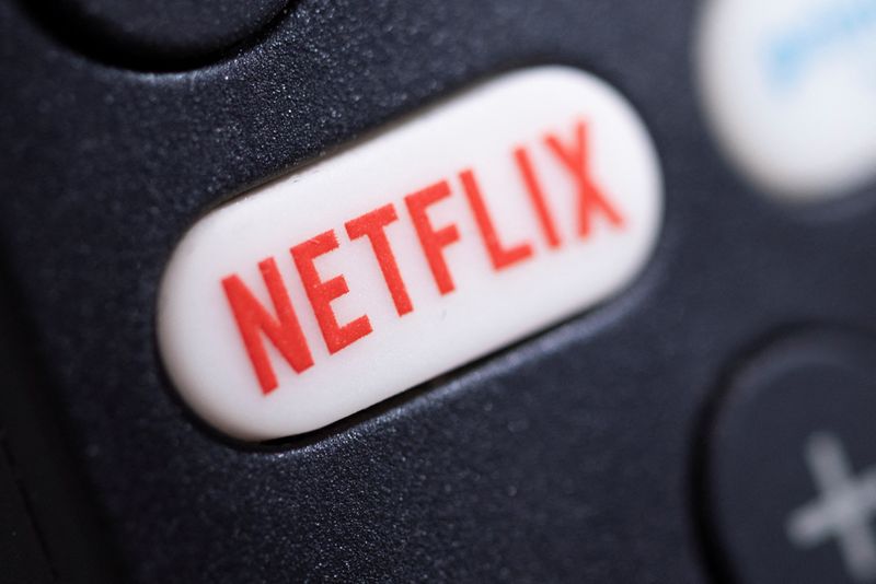 The Netflix logo is seen on a TV remote controller,