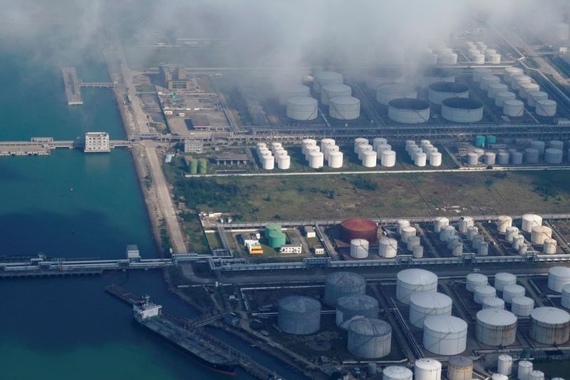FILE PHOTO: Oil and gas tanks are seen at an