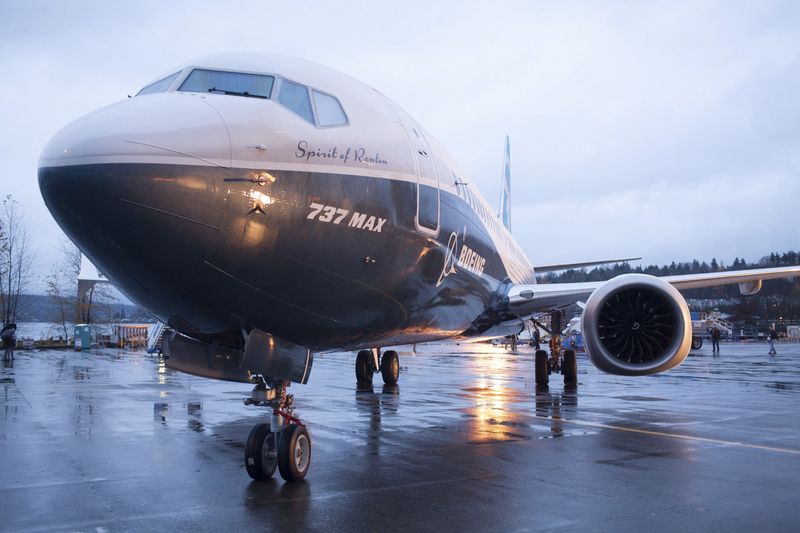 A Boeing 737 MAX 8 sits outside the hangar during