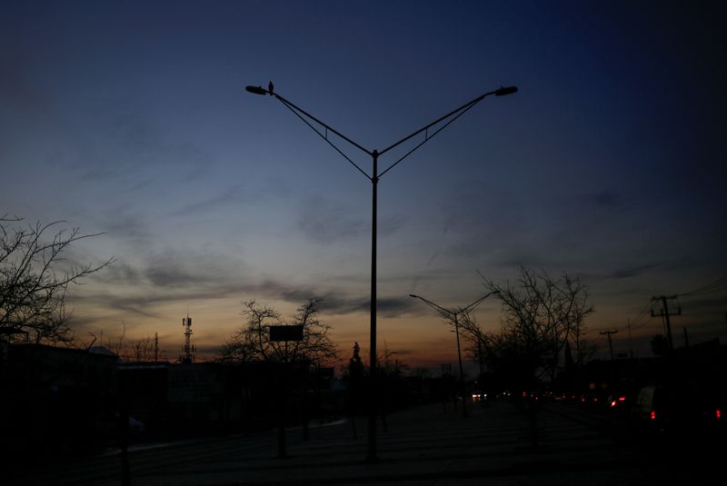 Light poles are pictured without power during an outage in