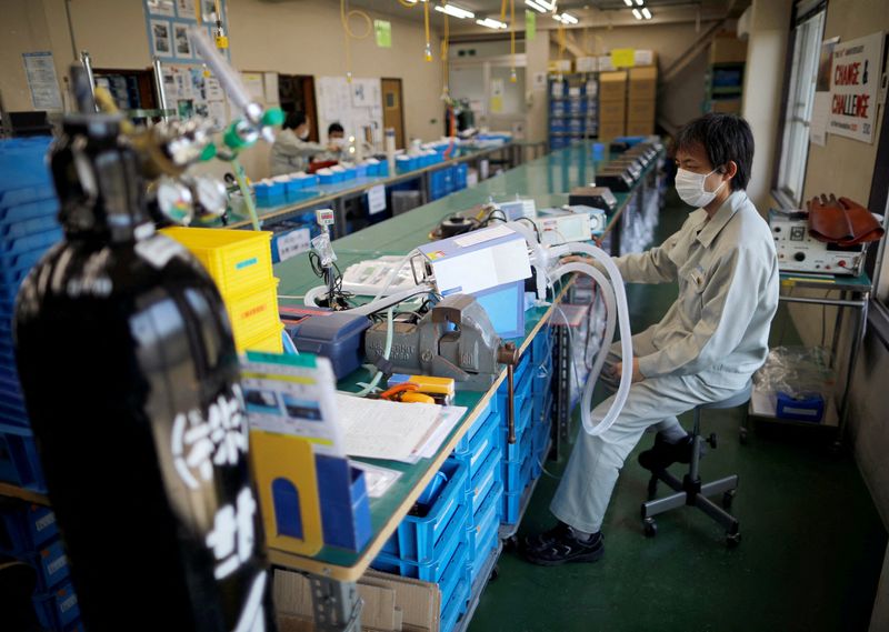 FILE PHOTO: Employees of Sanko Manufacturing Co. are seen at
