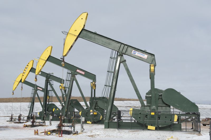 Pumpjacks taken out of production temporarily stand idle at a