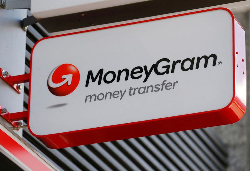 FILE PHOTO: A Moneygram logo is seen outside a bank
