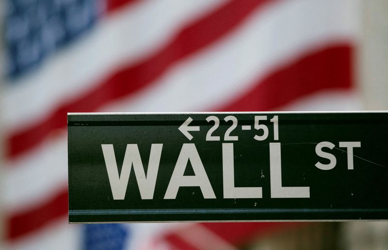 FILE PHOTO: A Wall Street sign hangs on a signpost