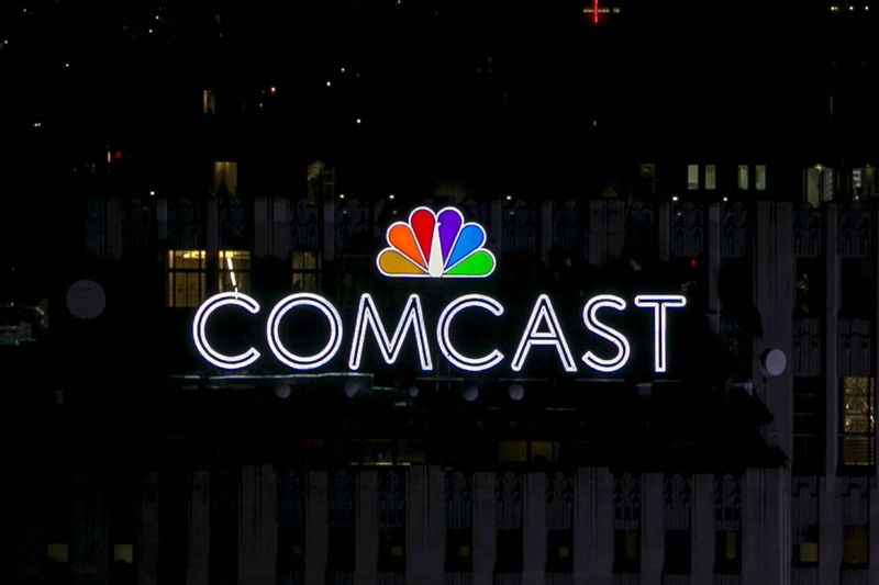 FILE PHOTO: The NBC and Comcast logo are displayed on