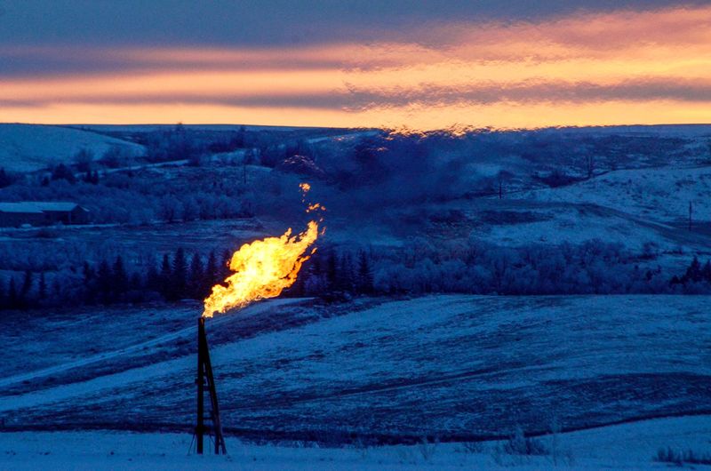 FILE PHOTO: A natural gas flare on an oil well