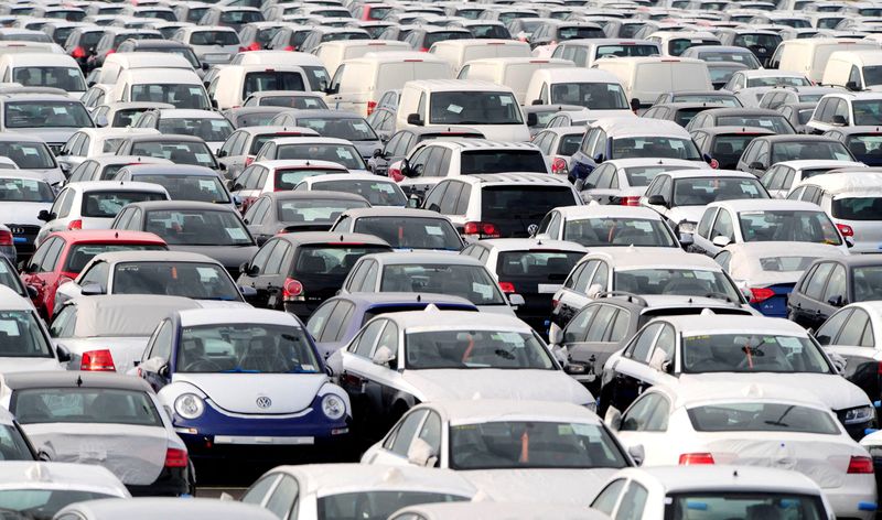 FILE PHOTO: New cars are seen waiting for transport at