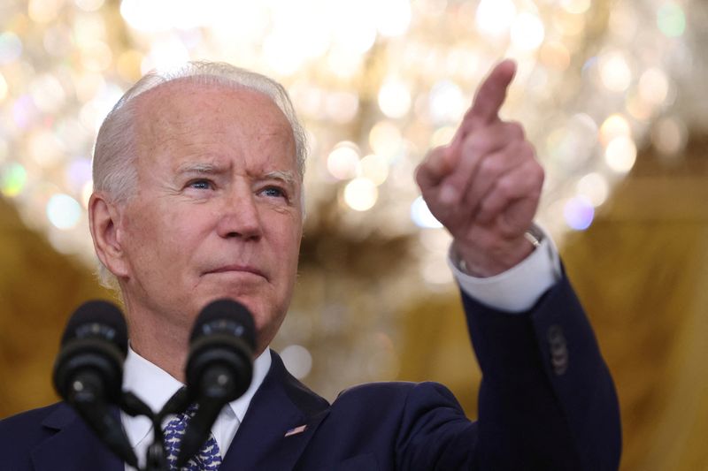 FILE PHOTO: U.S. President Joe Biden answers questions from reporters