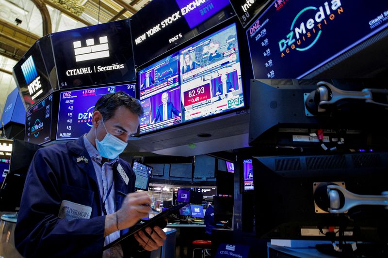 Traders work on the floor of the NYSE in New