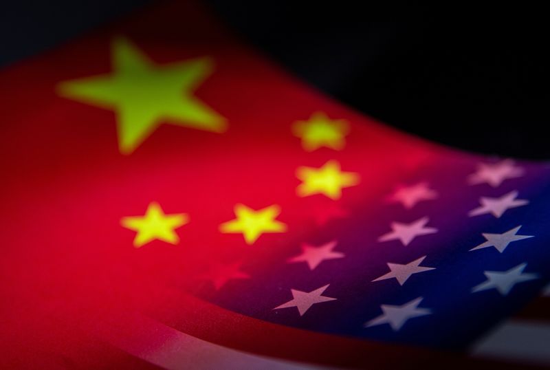 Illustration shows China’s and U.S.’ flags