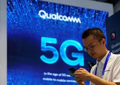 FILE PHOTO: Signs of Qualcomm and 5G are pictured at