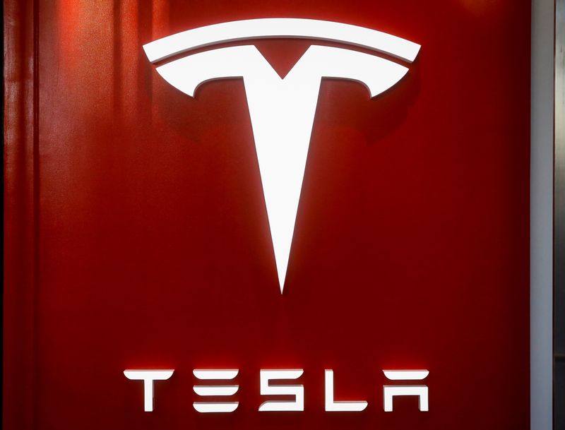 The Tesla logo is seen at the entrance to Tesla
