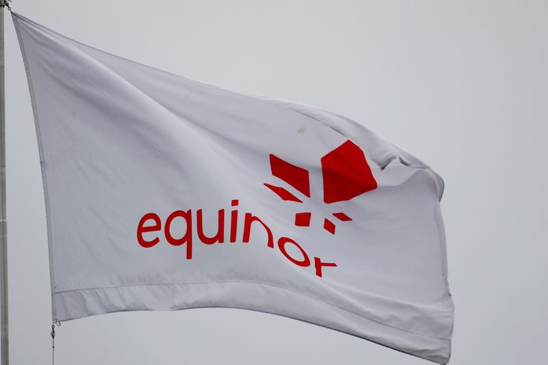 FILE PHOTO: Equinor’s flag flutters next to the company’s headqurters