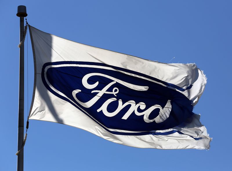A Ford flag flies outside the Oakville Assembly Plant as