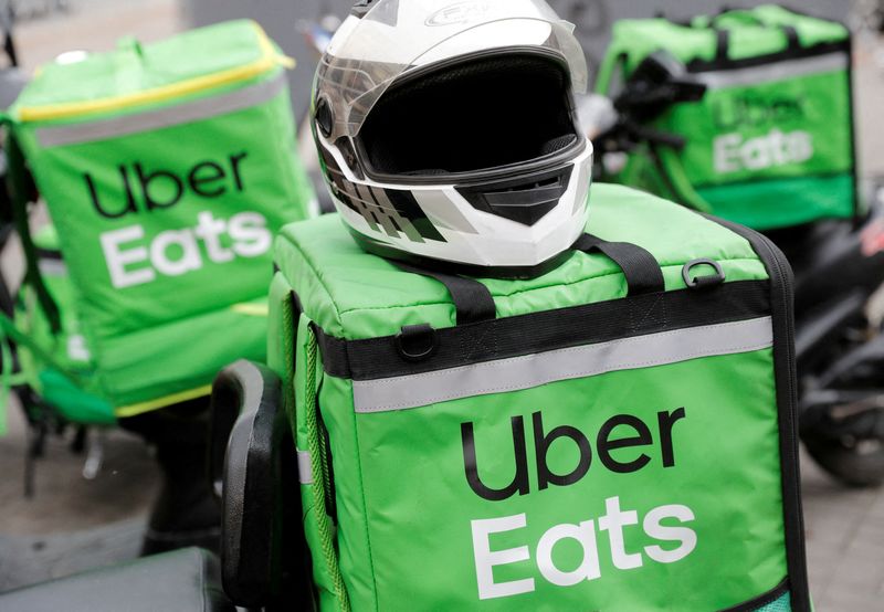 FILE PHOTO: Delivery bags with logos of Uber Eats are