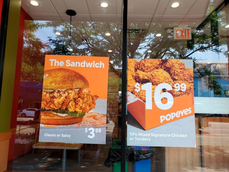 FILE PHOTO – Signs advertising menu items are seen at