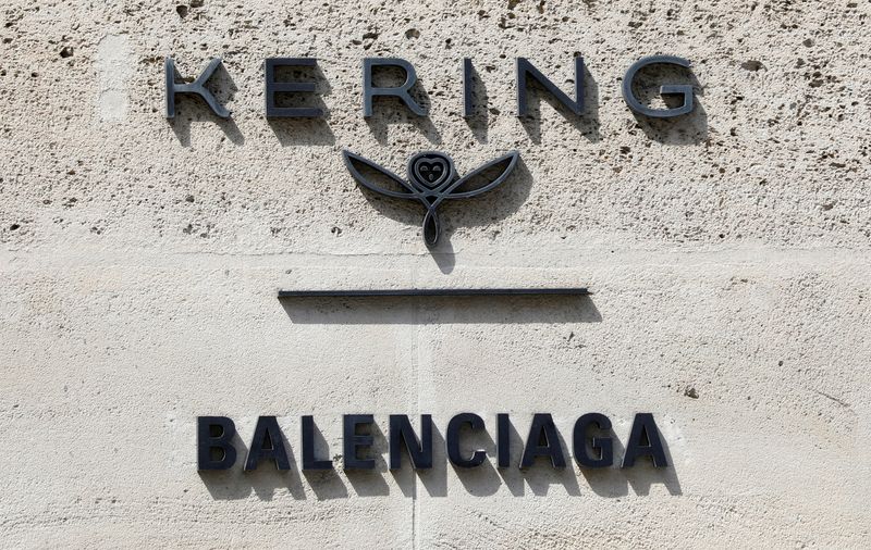 FILE PHOTO: The logos of French luxury group Kering and