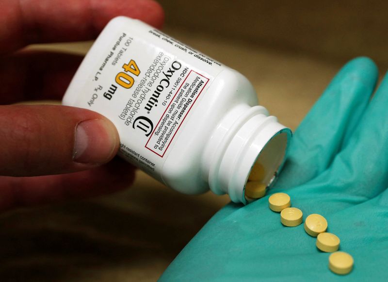 FILE PHOTO: A pharmacist holds prescription painkiller OxyContin at a