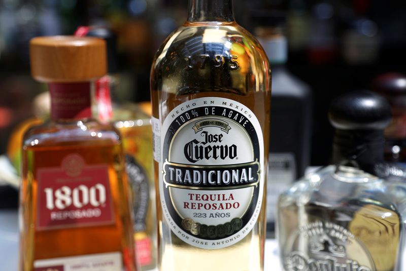 Bottles of tequila 1800, Jose Cuervo and Herradura are displayed
