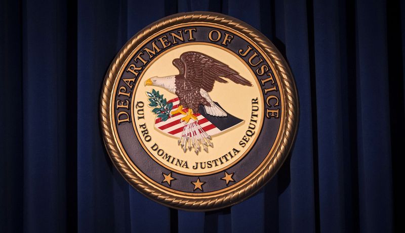 FILE PHOTO: The DOJ logo is pictured on a wall