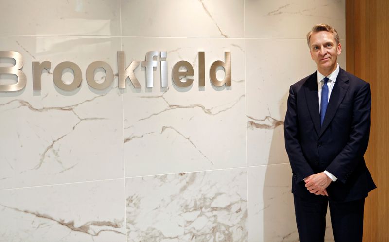 Bruce Flatt, CEO of Brookfield Asset Management, poses in front