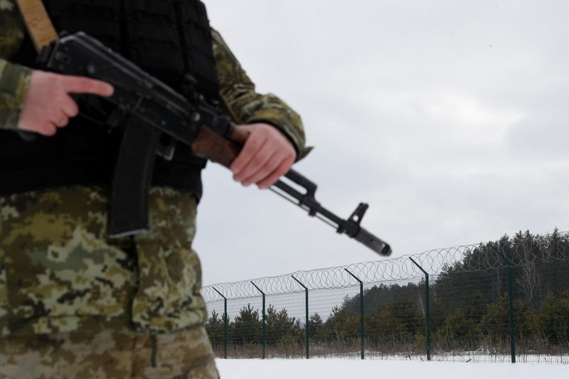 FILE PHOTO: Ukrainian border guards patrol the area near the