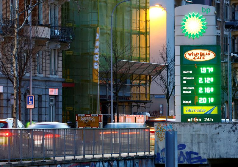 A display shows fuel prices at a BP gas station