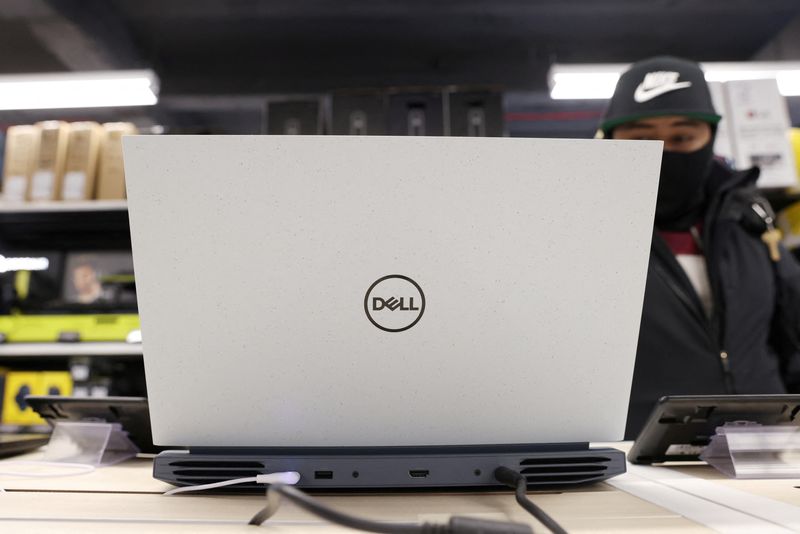 FILE PHOTO: A person looks at a Dell laptop for