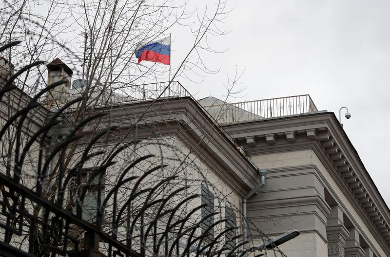 The national flag flutters at the Russian embassy in Kyiv