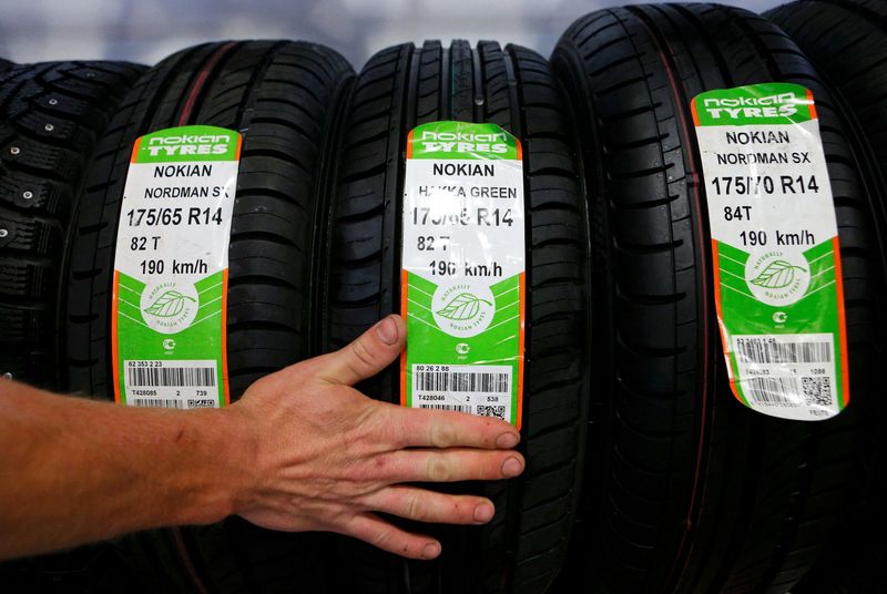 FILE PHOTO: An employee sorts Nokian tyres at a tyre