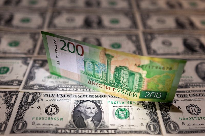 Illustration shows Russian Rouble banknote is placed on U.S. Dollar