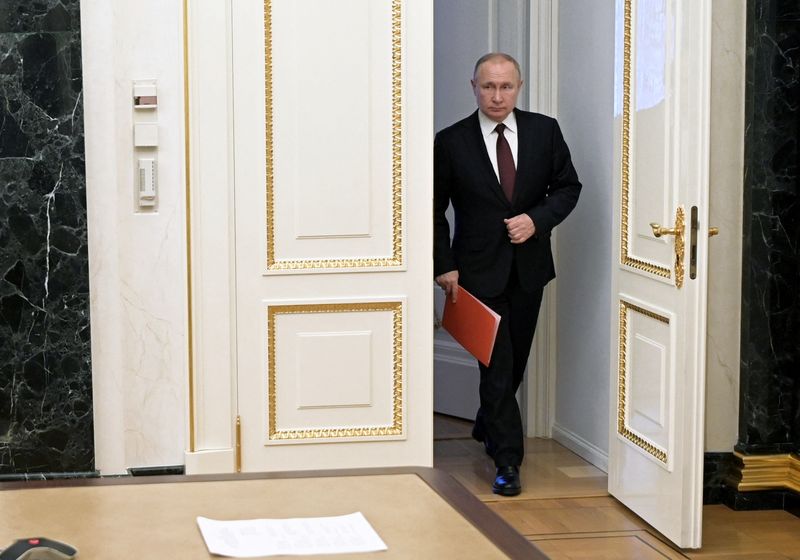 Russian President Putin attends a meeting with members of the