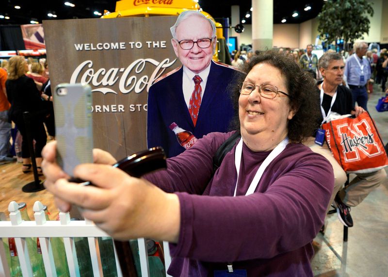 FILE PHOTO: A shareholder takes a selfie with a picture
