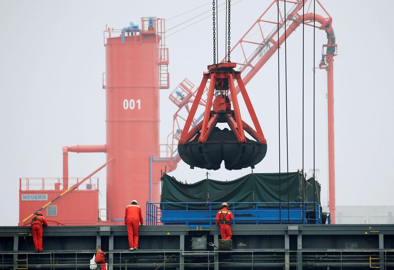 FILE PHOTO: Coal is loaded into a bulk carrier at