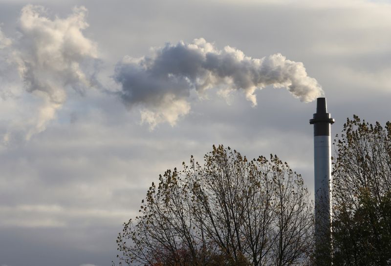 FILE PHOTO – Smoke billowing from a chimney is pictured,