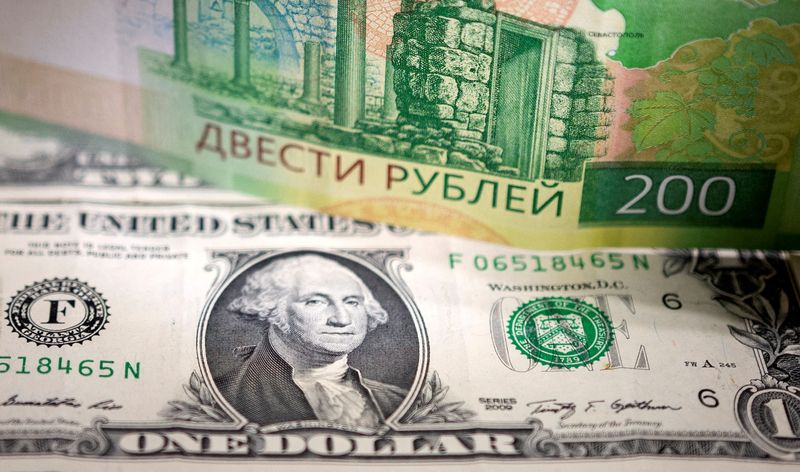 FILE PHOTO: Illustration shows Russian Rouble and U.S. Dollar banknotes