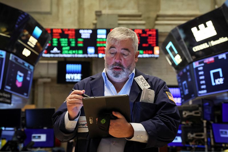 A trader works on the floor of the NYSE in